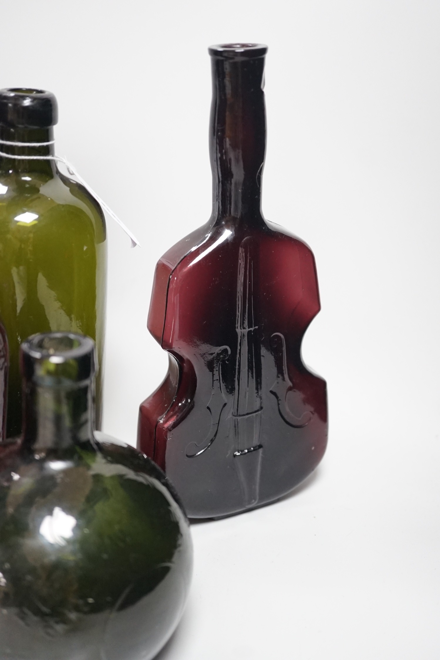A collection 19th/20th century coloured glass bottles and jugs